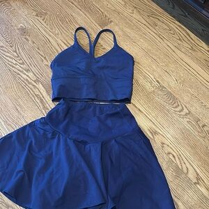 Halara two piece swirl skirt with v front and matching tank top